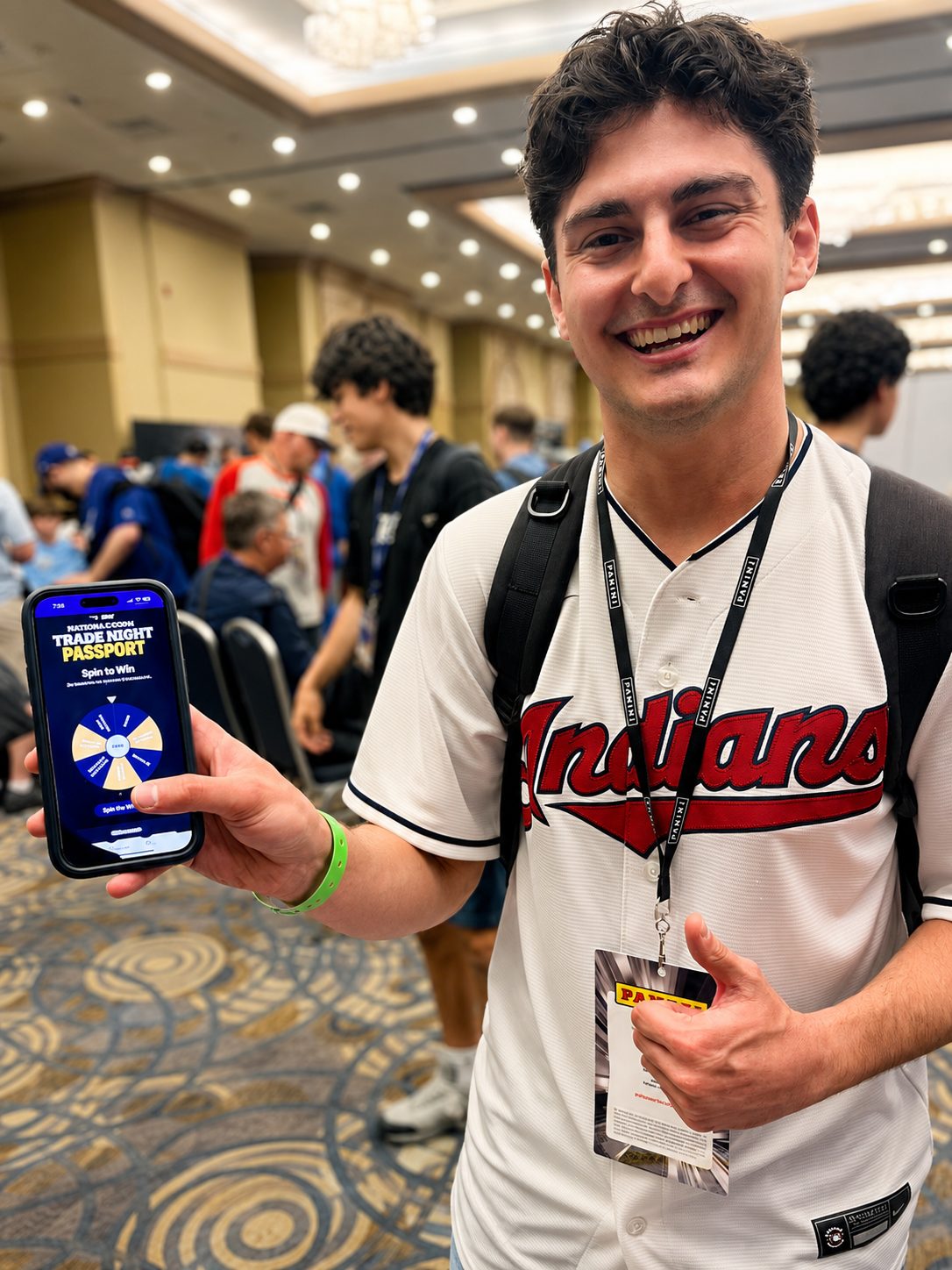 A collector showing the Spin to Win wheel on his Trade Night Passport