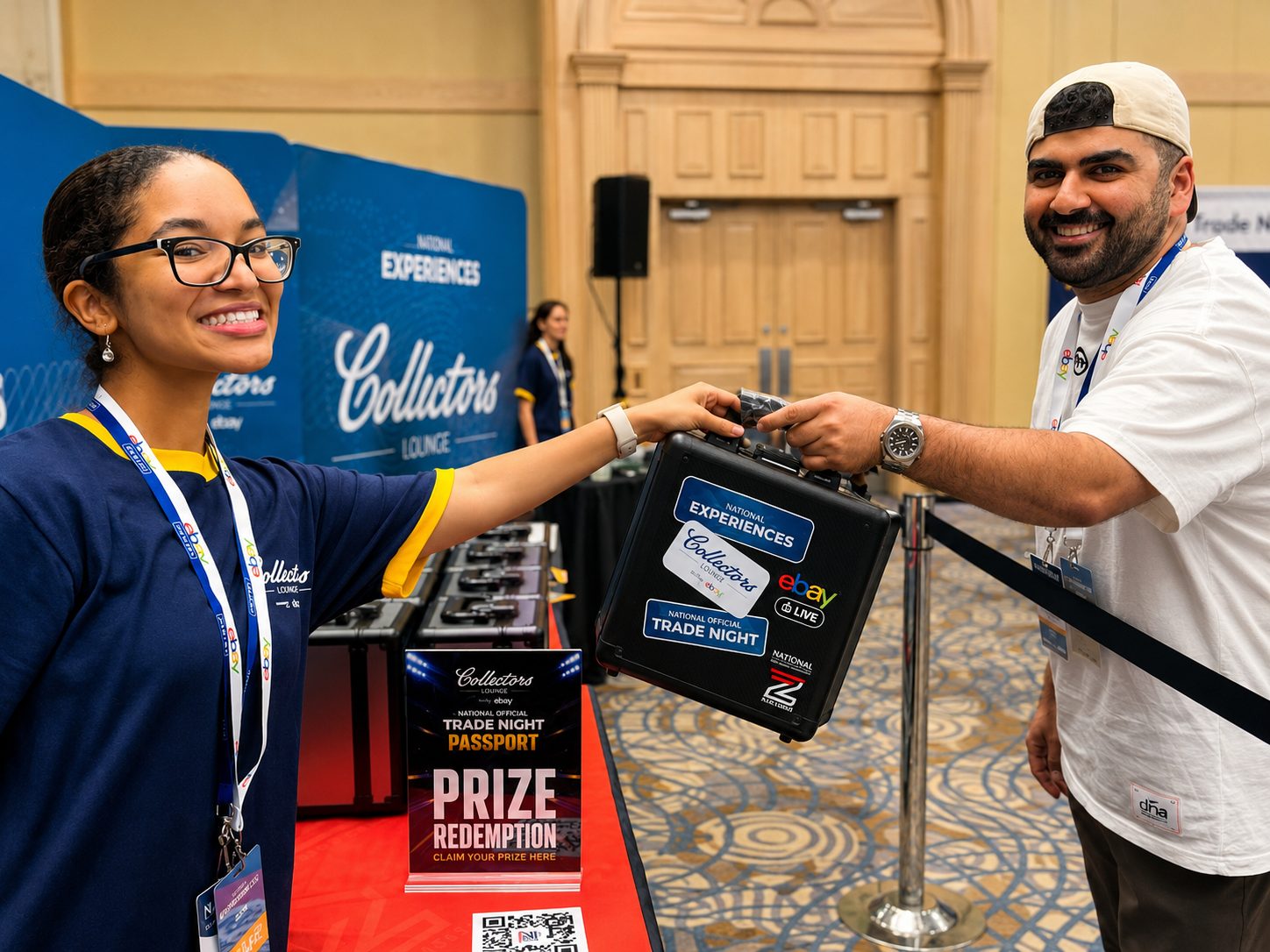 A staff member handing a prize case to a winner at the redemption booth